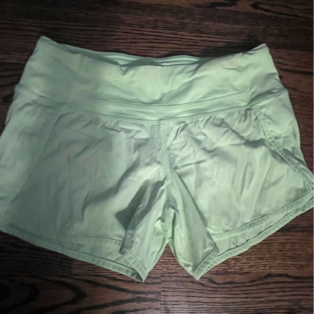 Size four - yellow running shorts - small mark on waistband - perfect condition!
